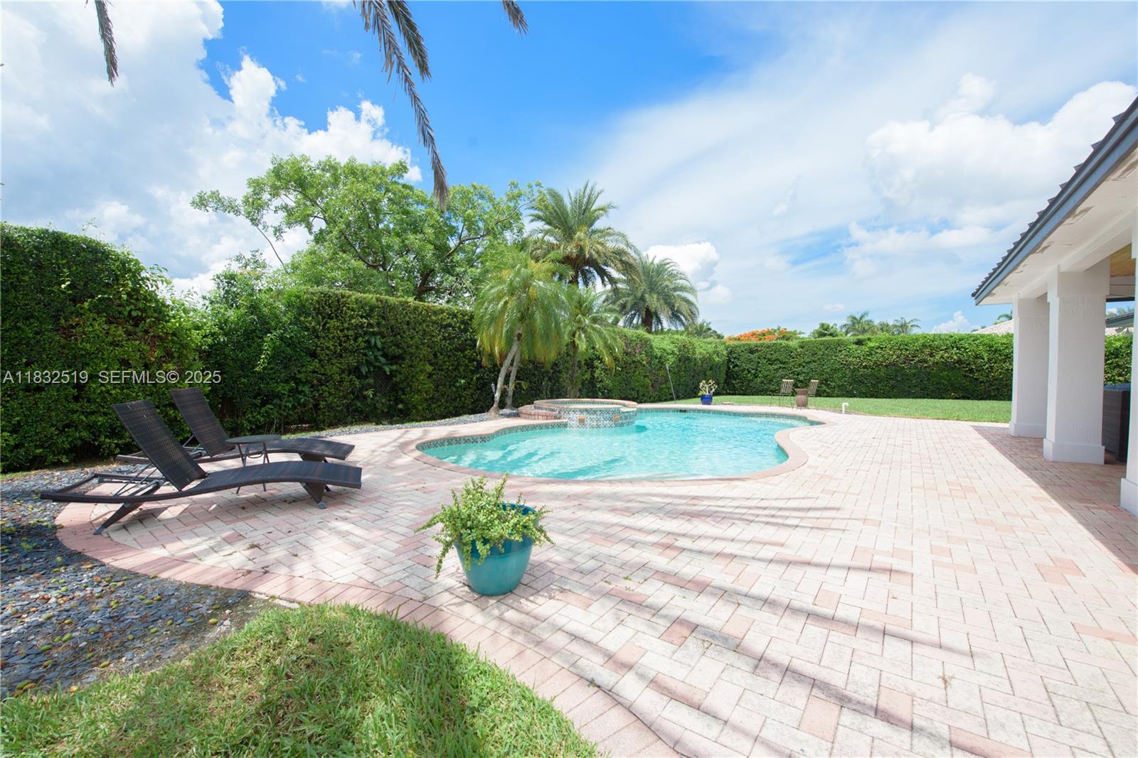 18740 Southwest 297th Street Homestead, FL 33030 - Photo 21 of 46 a view of a swimming pool with a patio