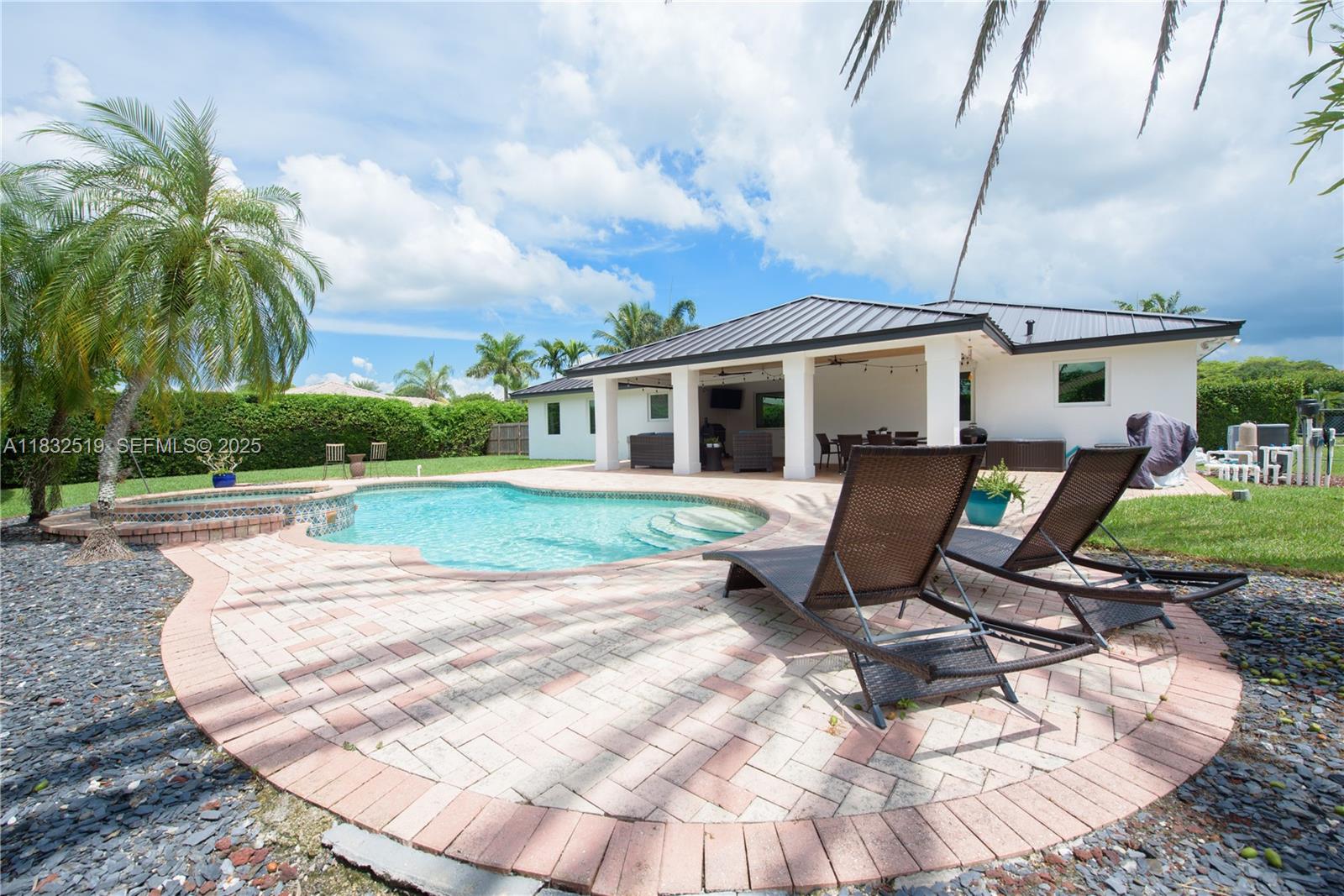18740 Southwest 297th Street Homestead, FL 33030 - Photo 23 of 46 a view of a house with backyard sitting area and tub