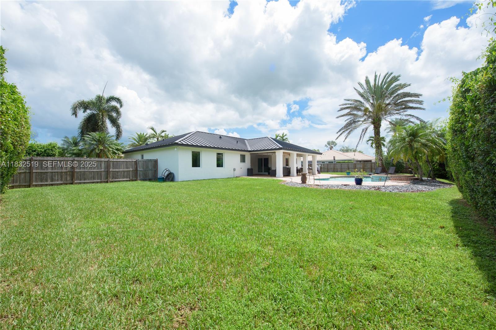 18740 Southwest 297th Street Homestead, FL 33030 - Photo 25 of 46 a front view of house with yard and green space