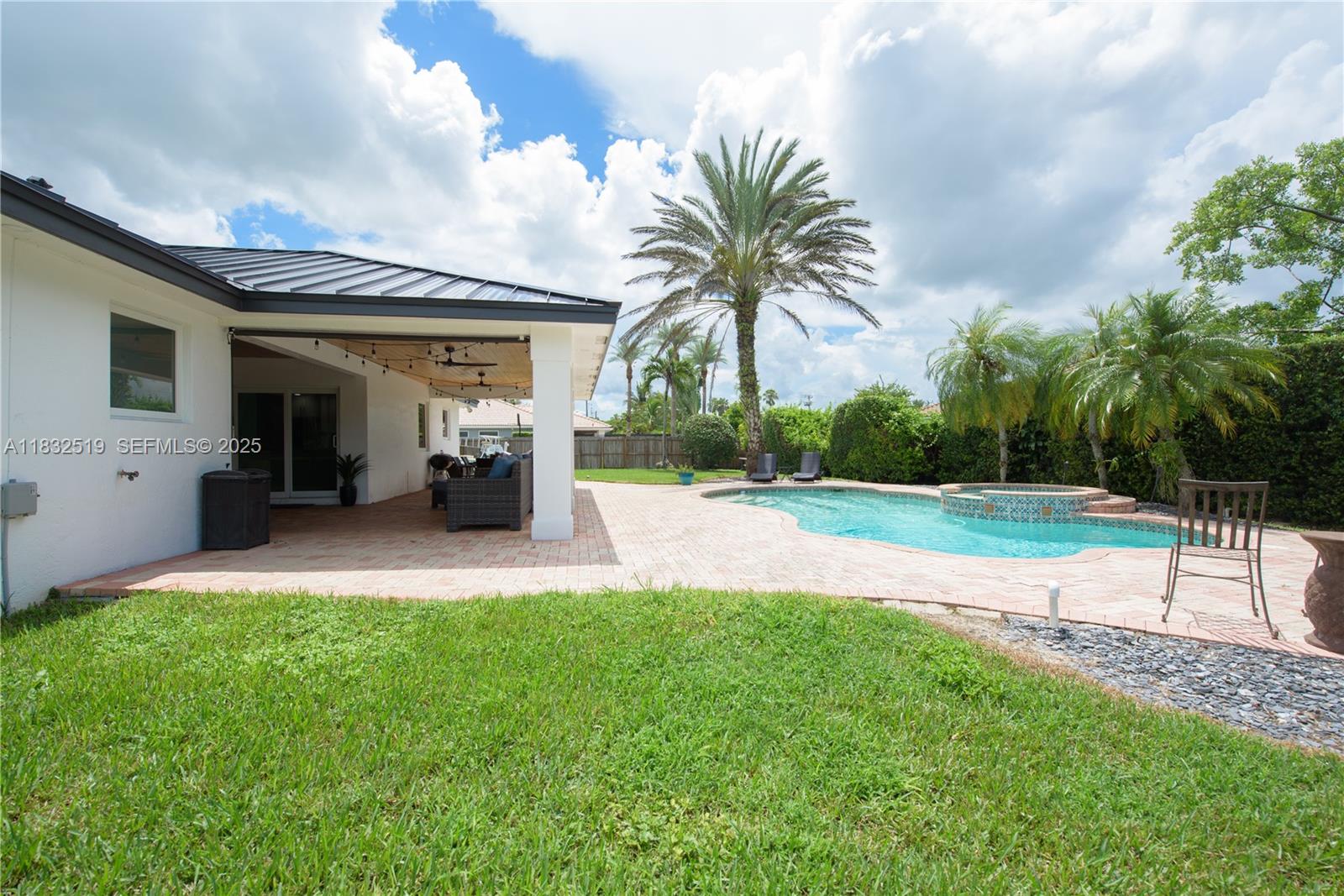 18740 Southwest 297th Street Homestead, FL 33030 - Photo 26 of 46 a view of a backyard with potted plants and palm tree