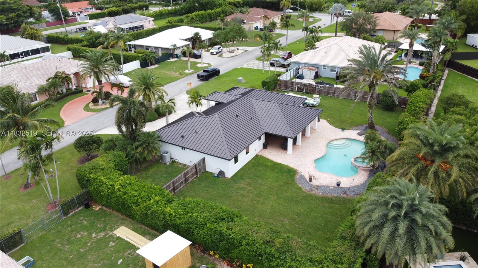 18740 Southwest 297th Street Homestead, FL 33030 - Photo 35 of 46 an aerial view of residential houses with outdoor space and trees
