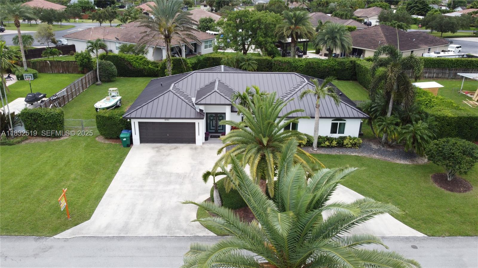 18740 Southwest 297th Street Homestead, FL 33030 - Photo 37 of 46 a view of a house with a garden