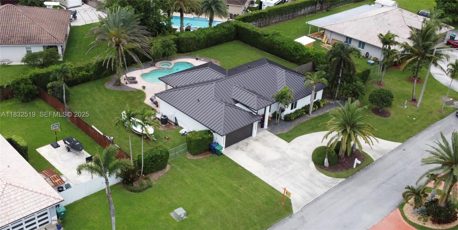 18740 Southwest 297th Street Homestead, FL 33030 - Photo 38 of 46 an aerial view of a house with garden space and street view
