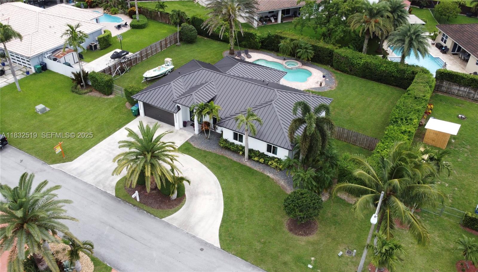 18740 Southwest 297th Street Homestead, FL 33030 - Photo 40 of 46 an aerial view of a house with swimming pool and lake view