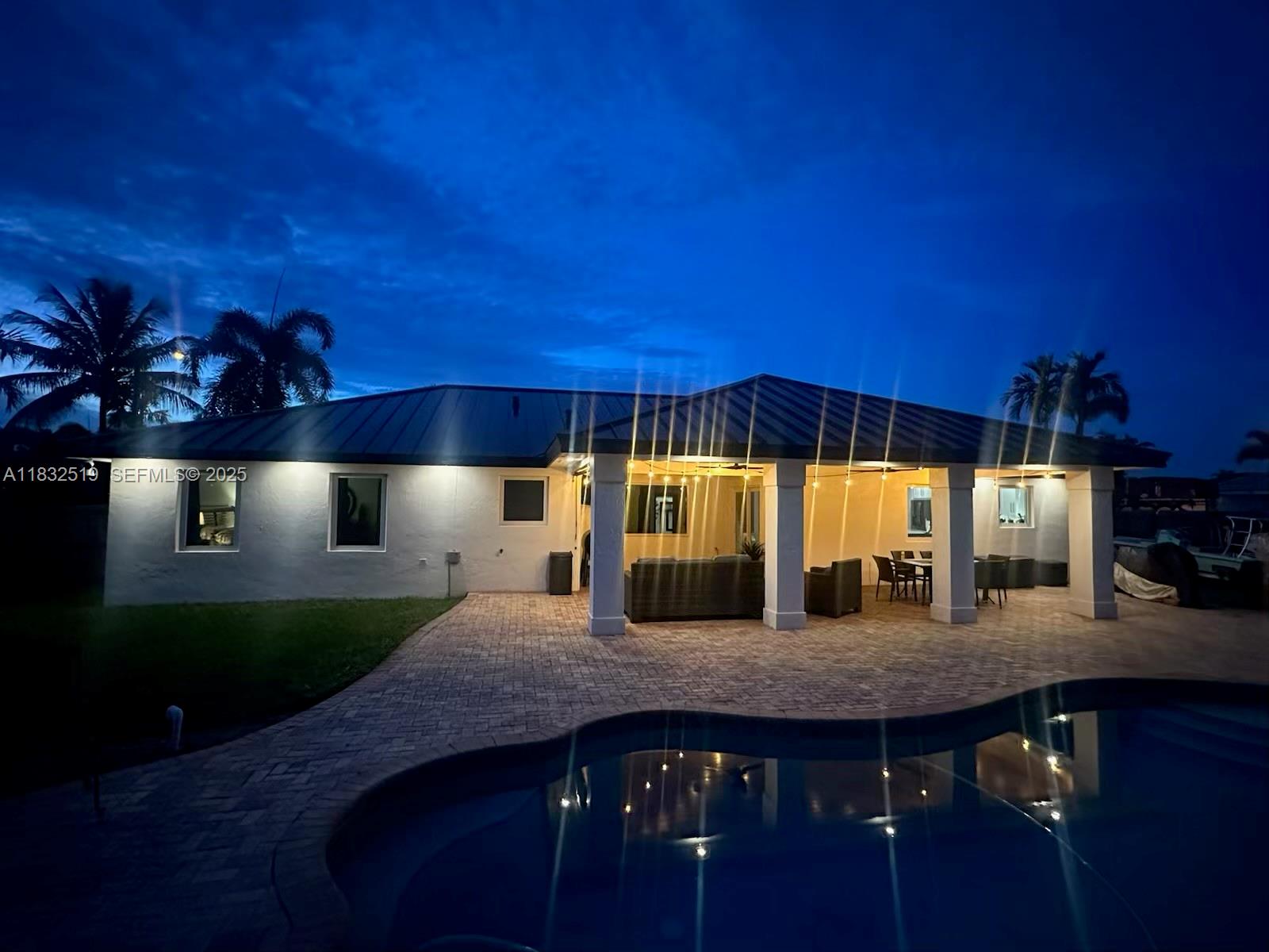 18740 Southwest 297th Street Homestead, FL 33030 - Photo 42 of 46 a kitchen with a table and chairs