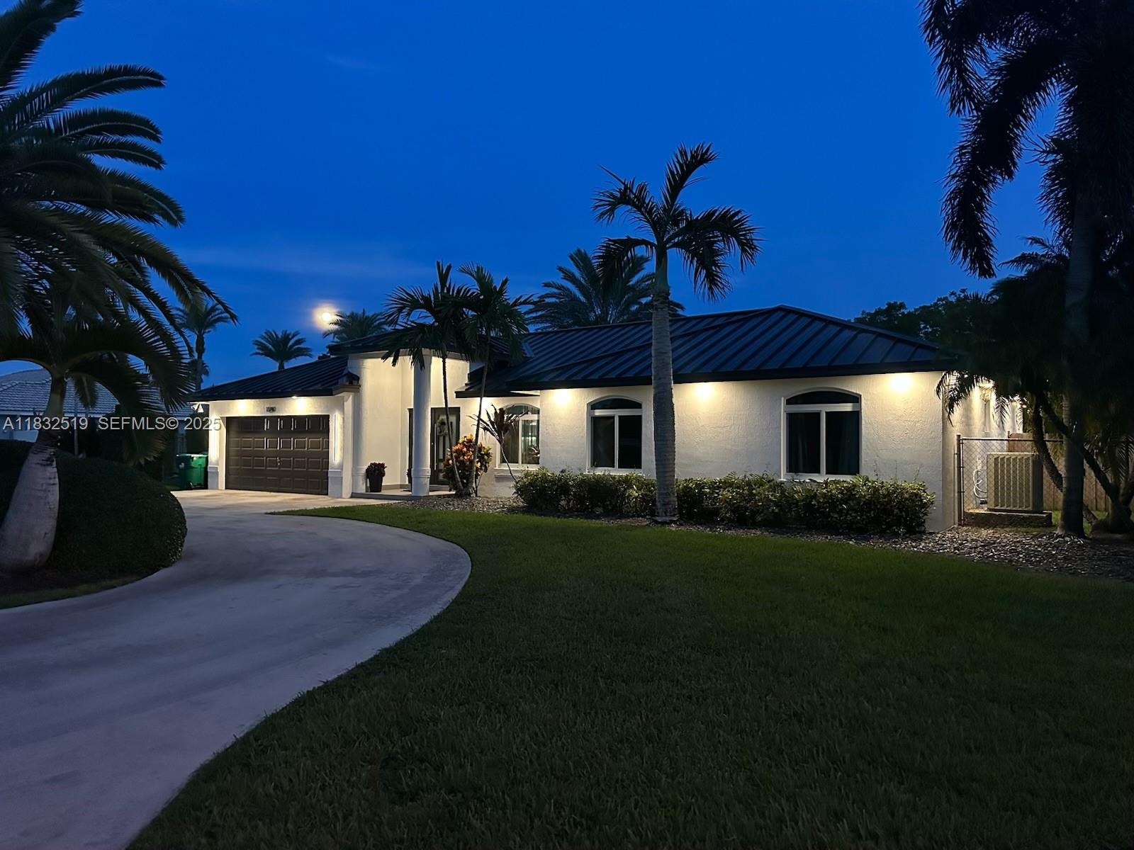 18740 Southwest 297th Street Homestead, FL 33030 - Photo 45 of 46 a front view of a house with a garden