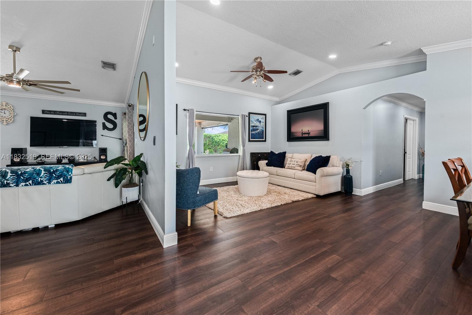 18740 Southwest 297th Street Homestead, FL 33030 - Photo 5 of 46 a living room with furniture flat screen tv and wooden floor
