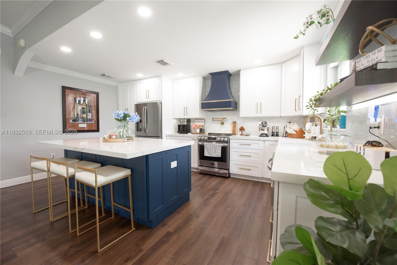 18740 Southwest 297th Street Homestead, FL 33030 - Photo 8 of 46 a living room with stainless steel appliances kitchen island granite countertop wooden floors and a view of living room
