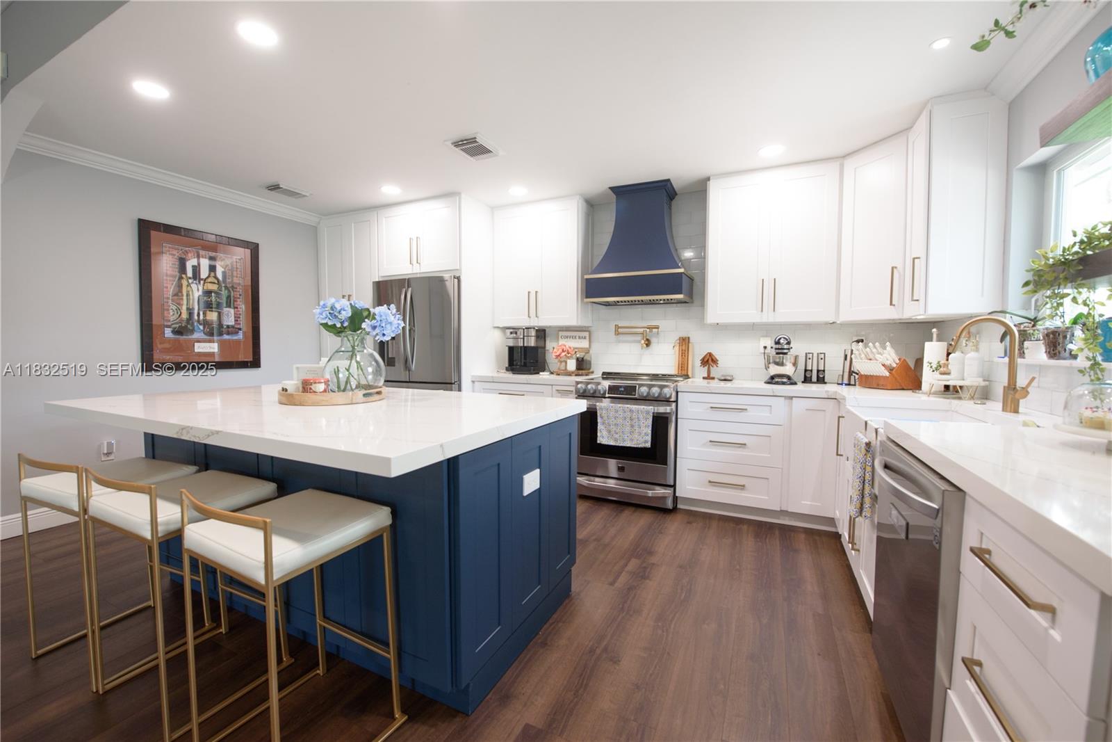 18740 Southwest 297th Street Homestead, FL 33030 - Photo 9 of 46 a kitchen with a sink microwave and cabinets