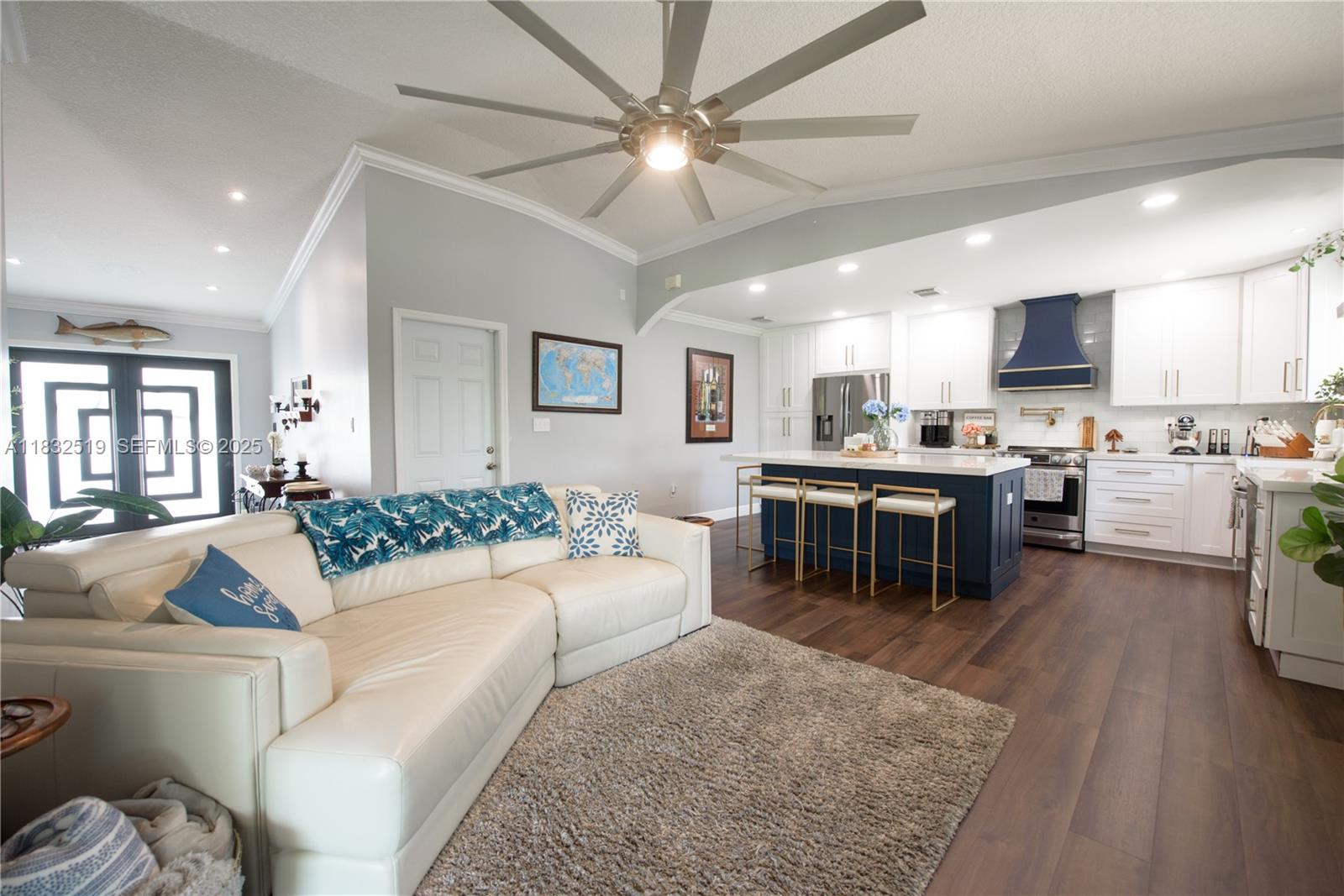 18740 Southwest 297th Street Homestead, FL 33030 - Photo 10 of 46 a living room with stainless steel appliances kitchen island granite countertop furniture and a kitchen view