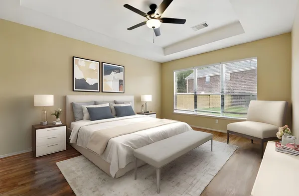 a bedroom with a bed and glass window