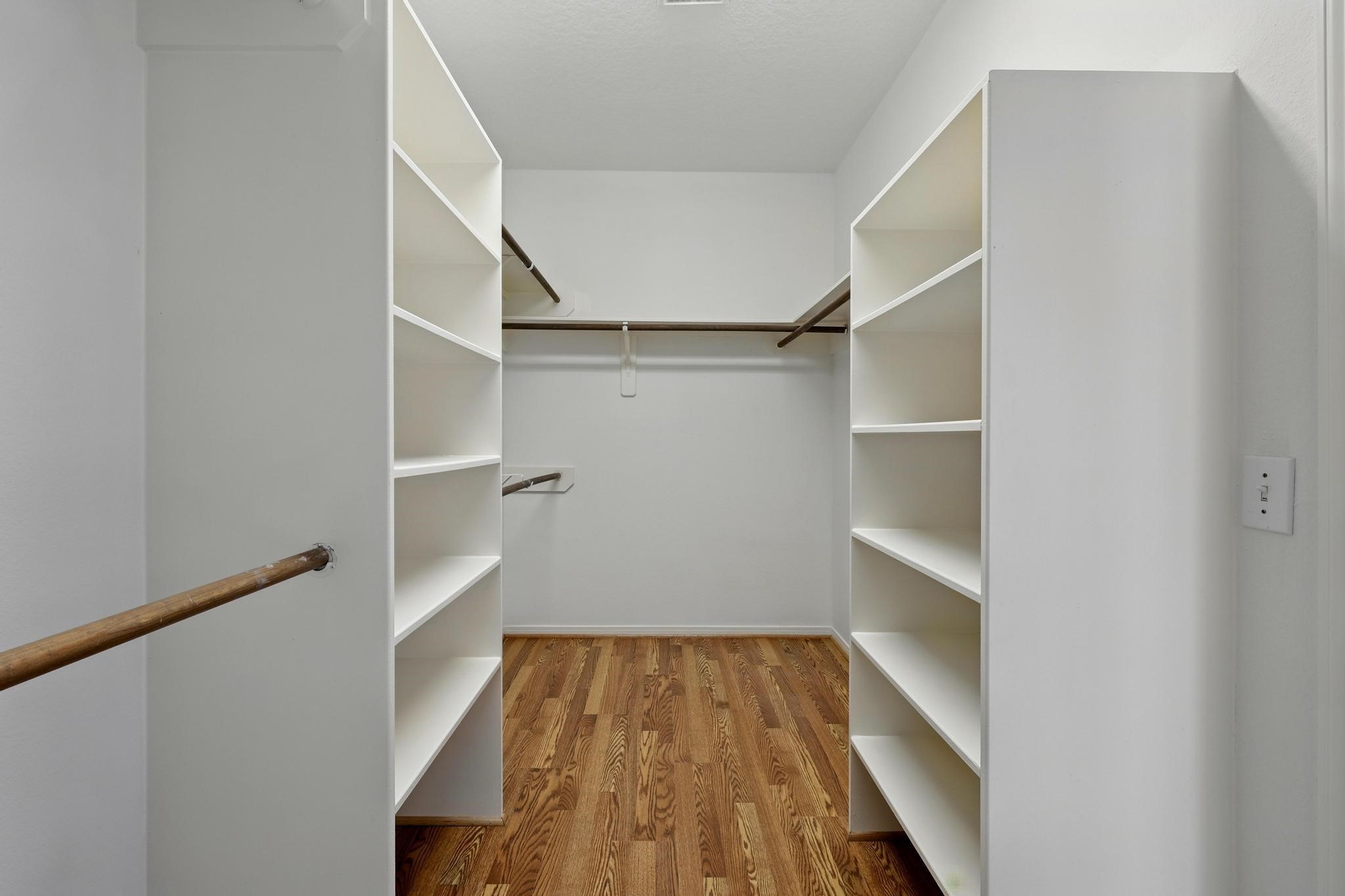 11030 Sprucedale Court Houston, TX 77070 - Photo 22 of 36 a view of a room with wooden floor and staircase