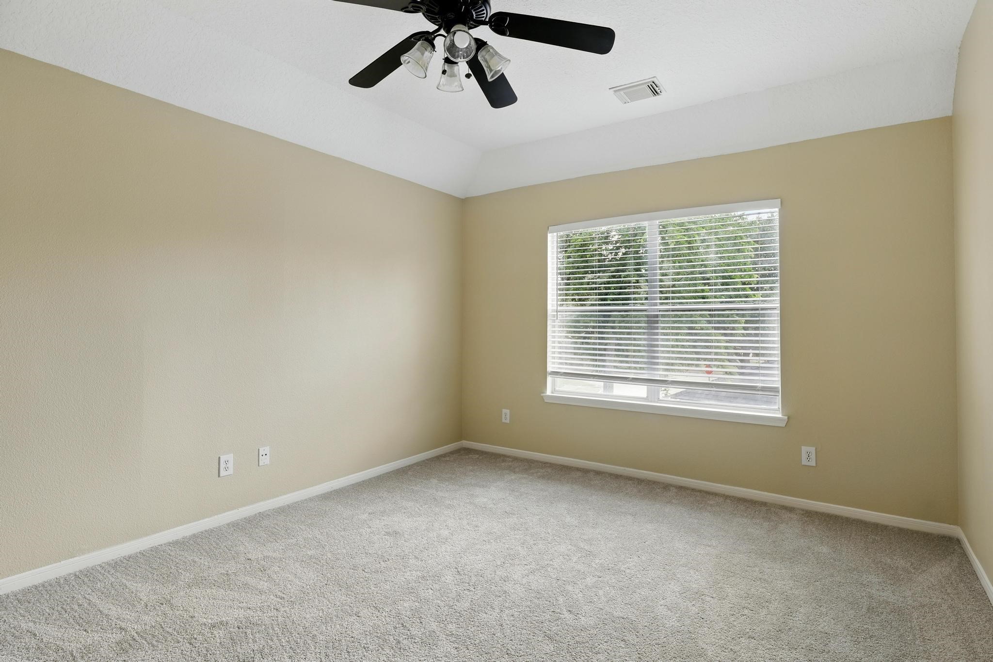 11030 Sprucedale Court Houston, TX 77070 - Photo 25 of 36 a view of an empty room with a window