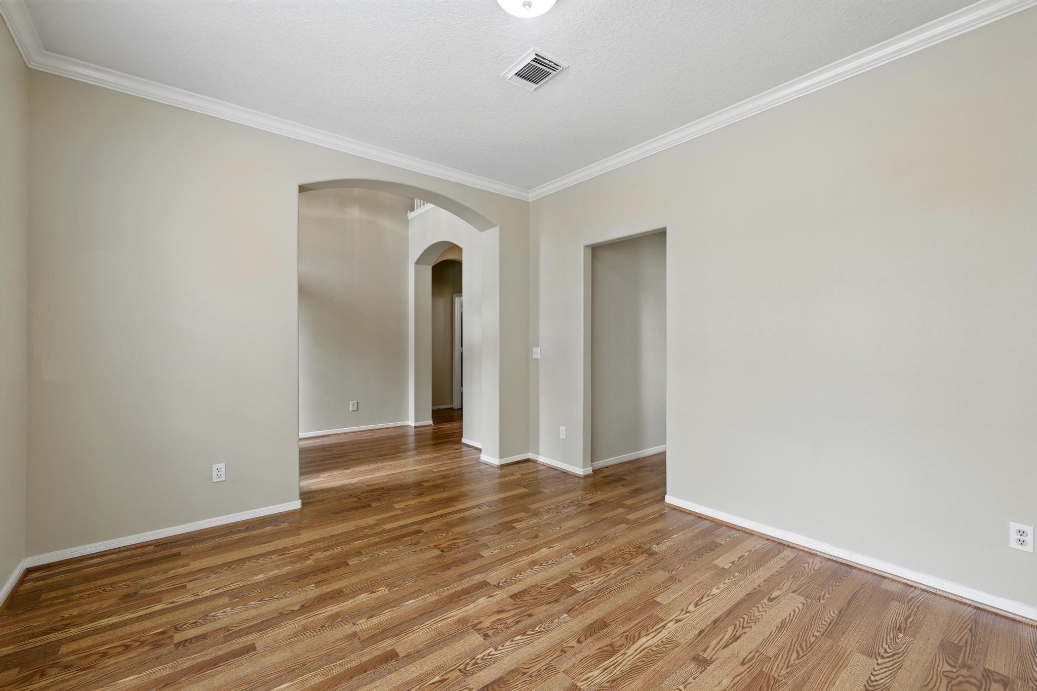 11030 Sprucedale Court Houston, TX 77070 - Photo 6 of 36 a view of an empty room with wooden floor