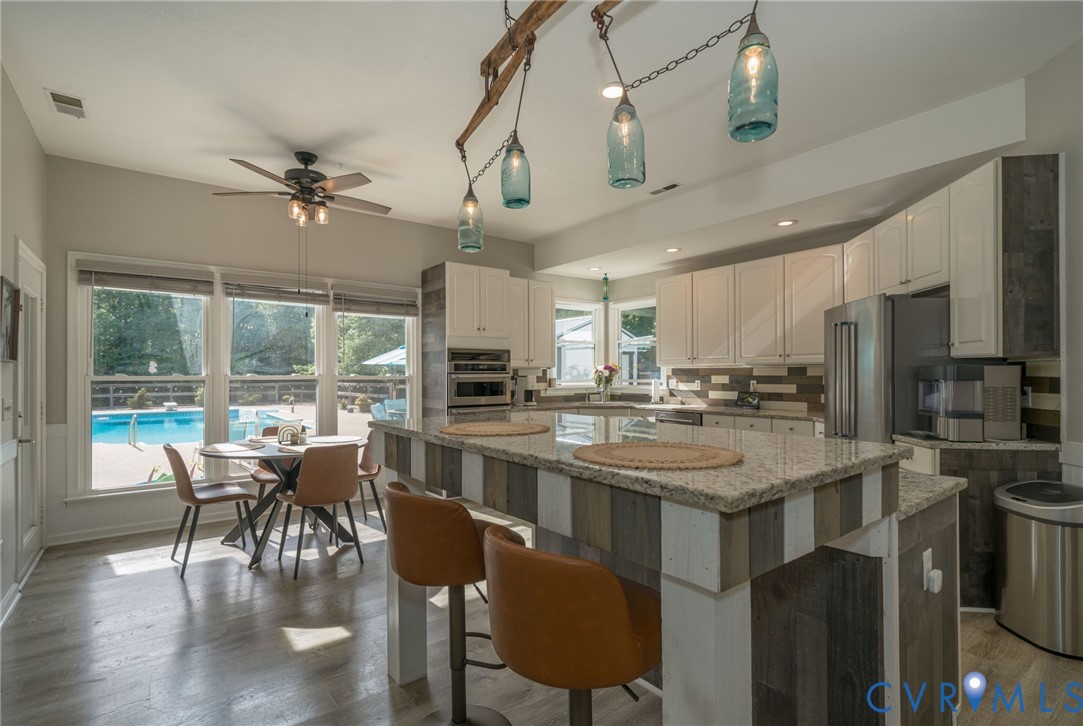 12700 Coalboro Road Chesterfield, VA 23838 - Photo 10 of 50 Kitchen featuring white cabinetry, stainless steel