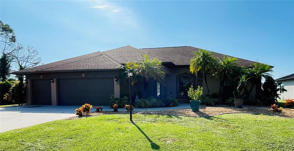 a view of house with yard outdoor seating and entertaining space