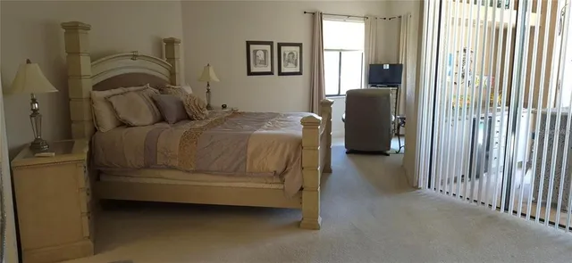 a bedroom with a bed and a mirror