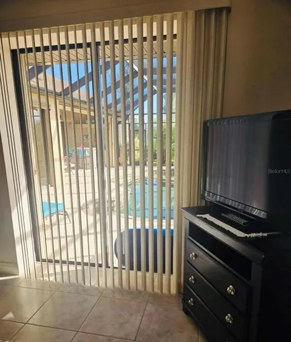 a view of a hall with wooden floor