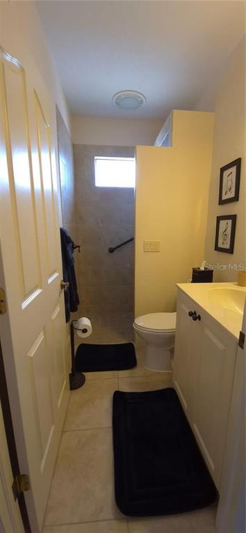 19 Medalist Way Rotonda West, FL 33947 - Photo 26 of 30 a bathroom with a sink a toilet and shower