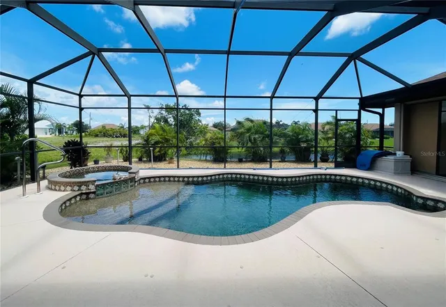 a view of a swimming pool and lounge chair