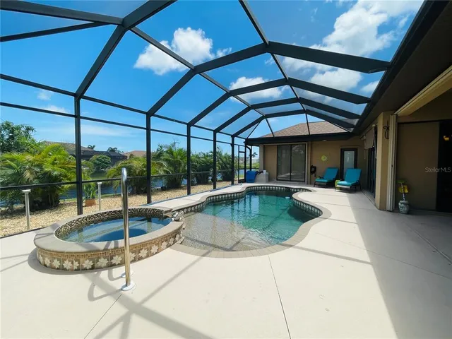 a view of a swimming pool with a patio