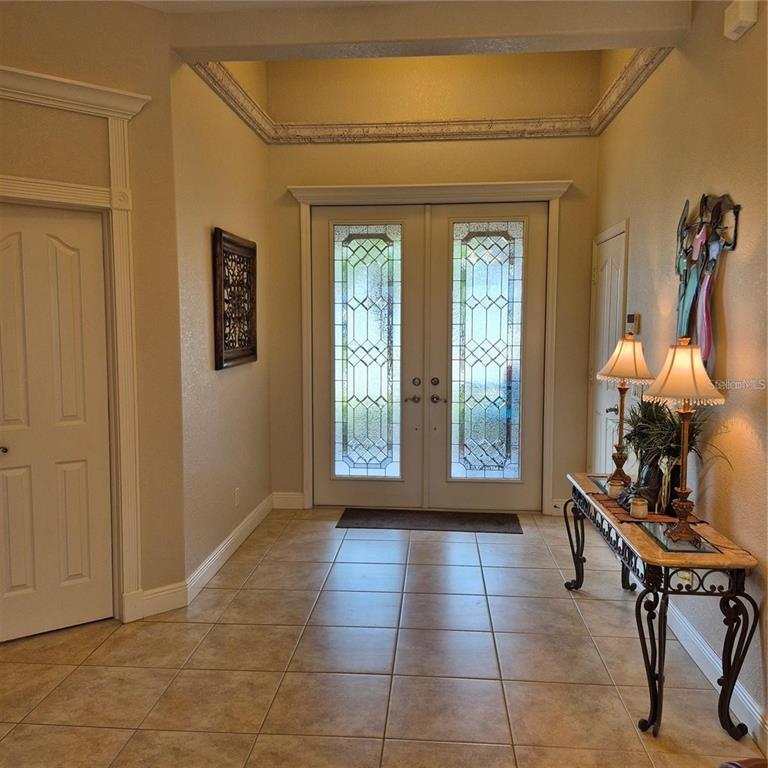 19 Medalist Way Rotonda West, FL 33947 - Photo 3 of 30 a room with furniture and a window