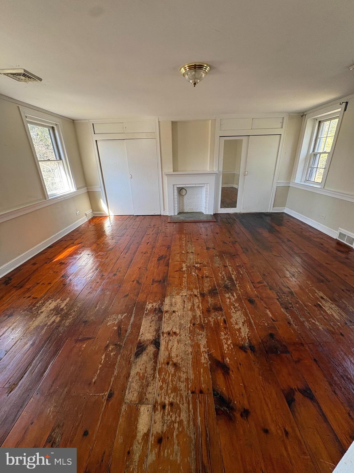 432 Quarry Road Ottsville, PA 18942 - Photo 13 of 29 a view of empty room with wooden floor and fan