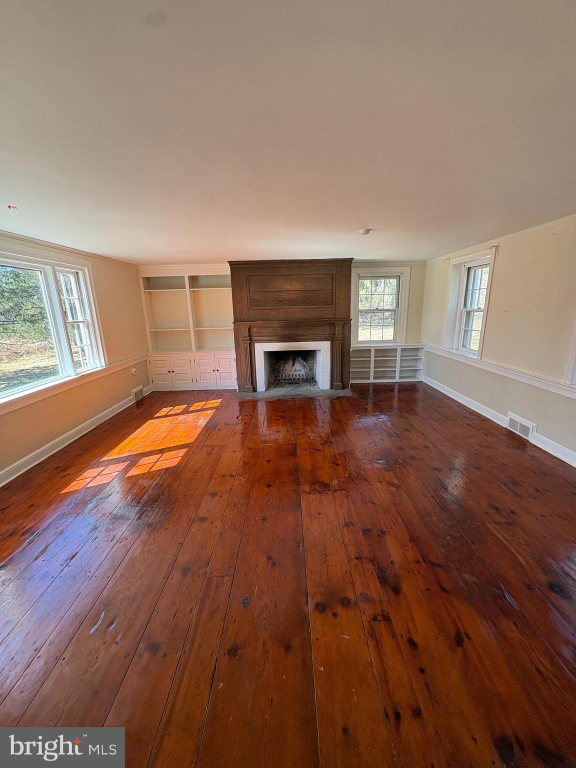 432 Quarry Road Ottsville, PA 18942 - Photo 17 of 29 a view of an empty room with window and fire place