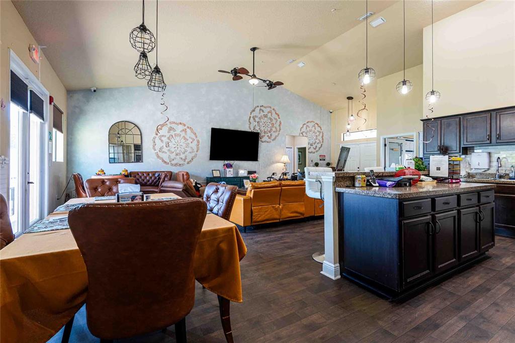 Undisclosed Address Spring Hill, FL 34608 - Photo 11 of 39 a living room with furniture and a flat screen tv
