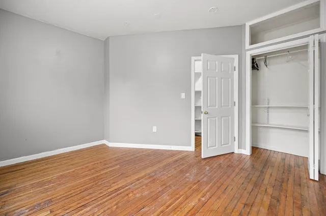 a view of wooden floor in an empty room
