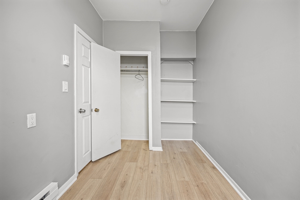 276 Washington Avenue, Unit 2 Chelsea, MA 02150 - Photo 20 of 28 a view of empty room with wooden floor