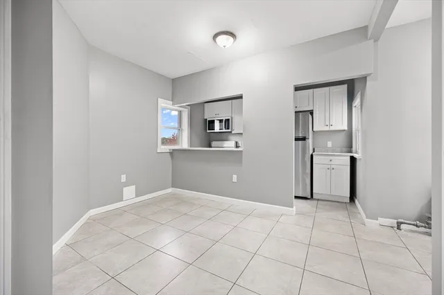 a view of a kitchen with a dishwasher and a refrigerator