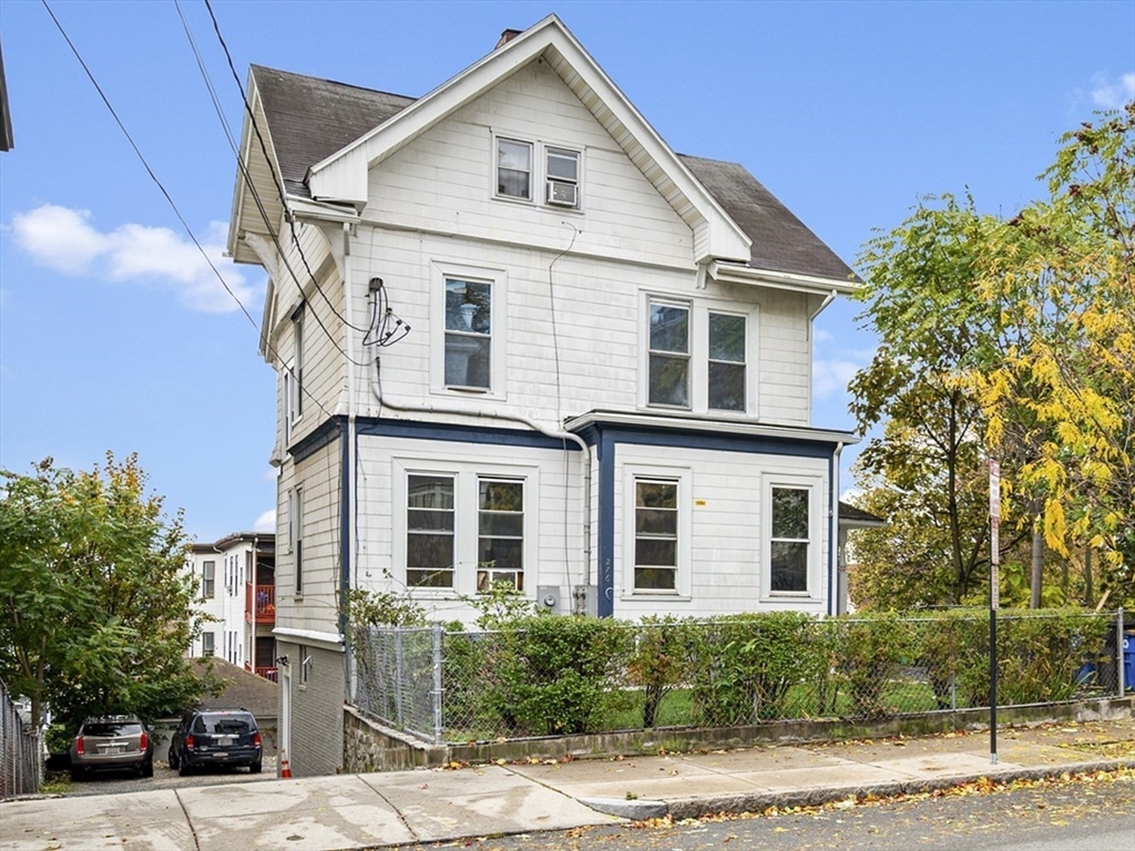 276 Washington Avenue, Unit 2 Chelsea, MA 02150 - Photo 24 of 28 a front view of a house with a yard