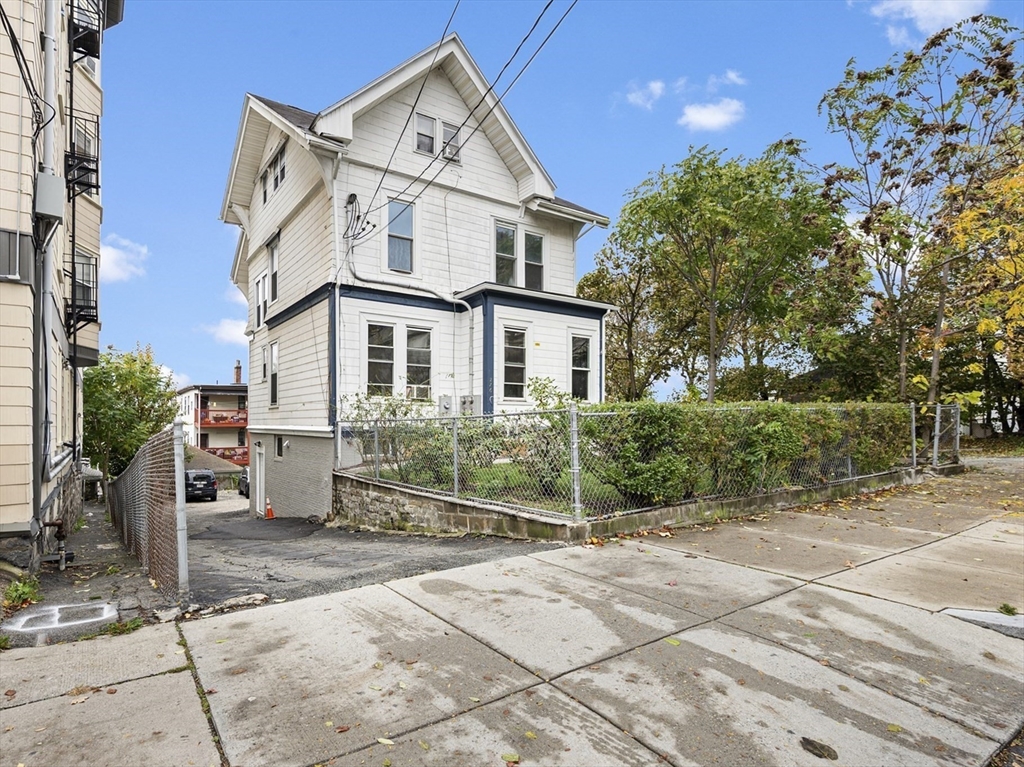 276 Washington Avenue, Unit 2 Chelsea, MA 02150 - Photo 25 of 28 a view of a white house with a outdoor space