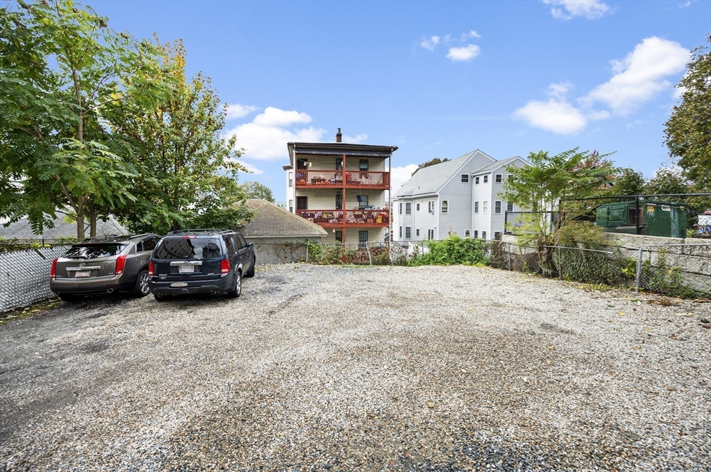 276 Washington Avenue, Unit 2 Chelsea, MA 02150 - Photo 26 of 28 a view of a car parked in front of a house