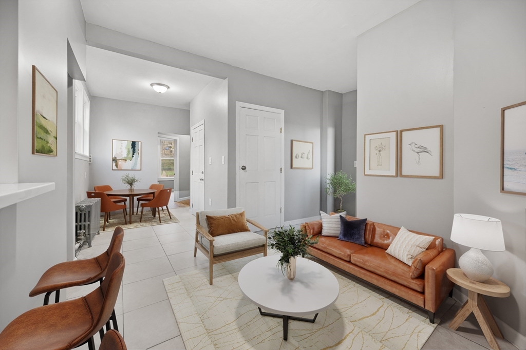 276 Washington Avenue, Unit 2 Chelsea, MA 02150 - Photo 3 of 28 a living room with furniture and a wooden floor