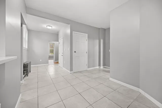 a view of a hallway with closet area