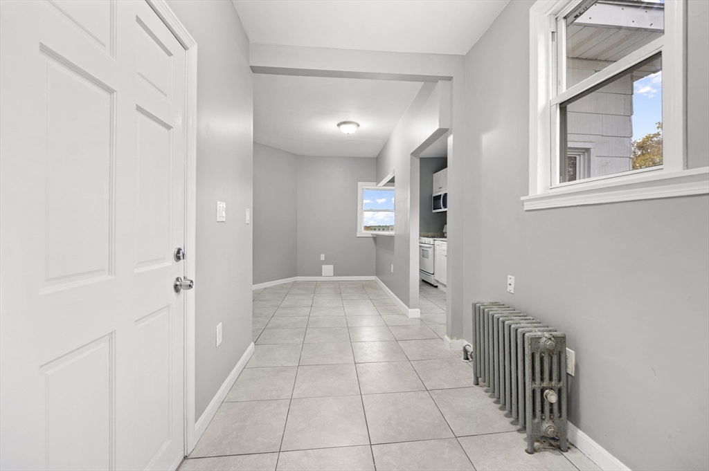 276 Washington Avenue, Unit 2 Chelsea, MA 02150 - Photo 7 of 28 a view of a hallway with closet and a bathroom