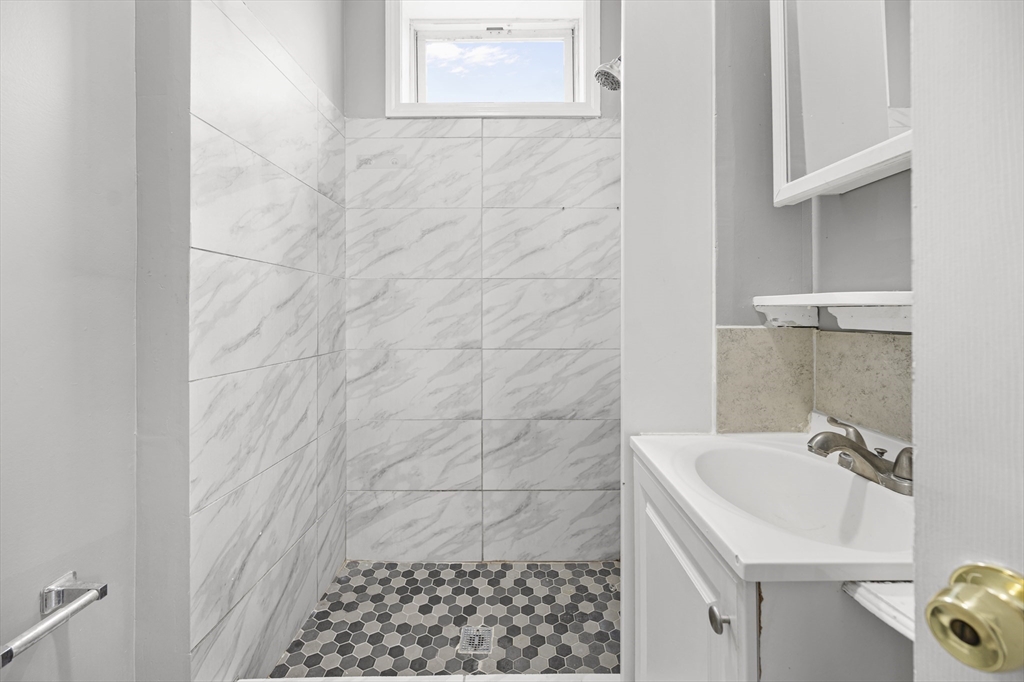 276 Washington Avenue, Unit 2 Chelsea, MA 02150 - Photo 8 of 28 a bathroom with a sink and a shower