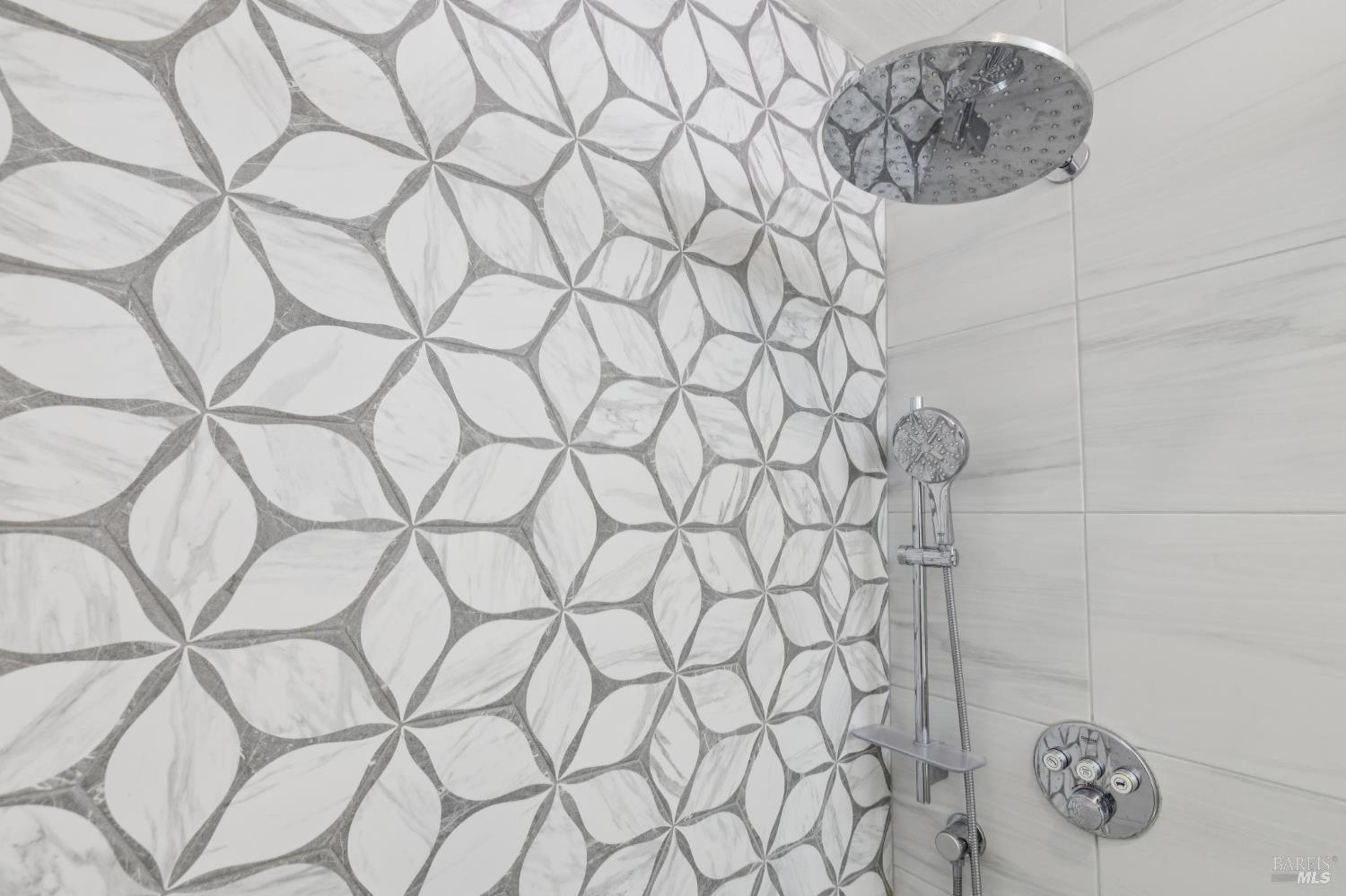 1045 Susan Way Novato, CA 94947 - Photo 54 of 62 Rain shower head and handheld shower in a walk-in shower.