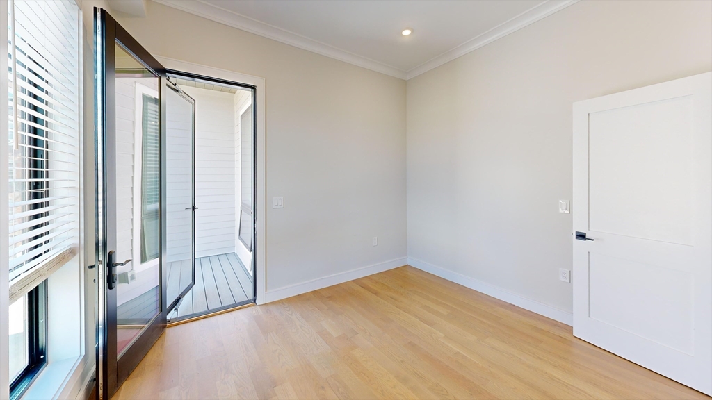 16-18 Highgate Street, Unit 202 Boston, MA 02134 - Photo 3 of 14 a view of a room with a large window