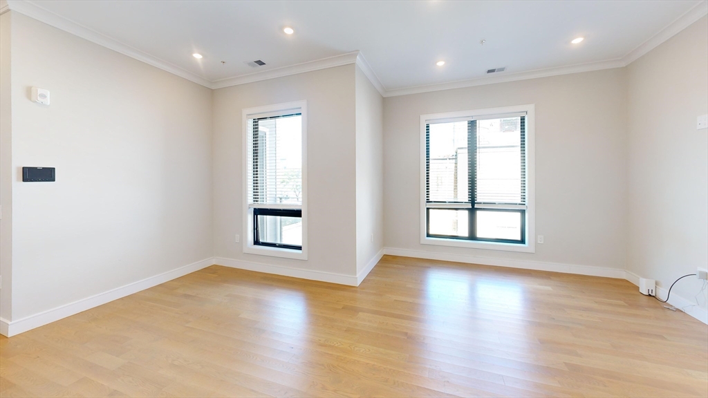 16-18 Highgate Street, Unit 202 Boston, MA 02134 - Photo 10 of 14 a view of livingroom with hardwood