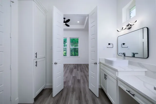 a bathroom with a glass shower door
