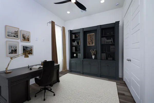a dining room with furniture and wooden floor