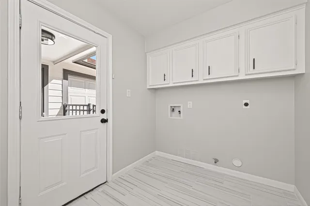 a spacious bedroom with a bed and a table in it