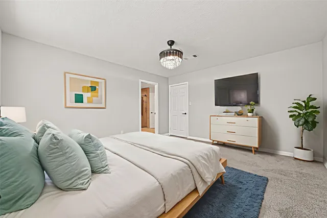 a bathroom with a shower sink and mirror