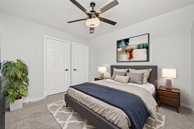 a bedroom with bed and window