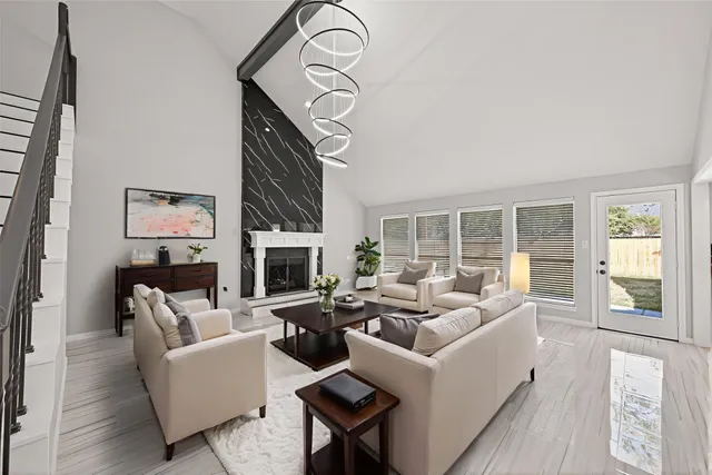 a living room with furniture and a fireplace