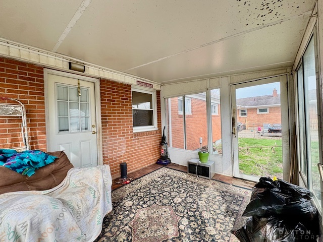 4733 Curtis Drive Springfield, OH 45503 - Photo 22 of 50 This bright sunroom offers a seamless connection to the outdoors, perfect for tranquil moments.