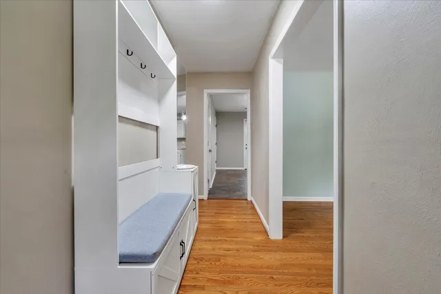 a view of a bathroom with sink and mirror